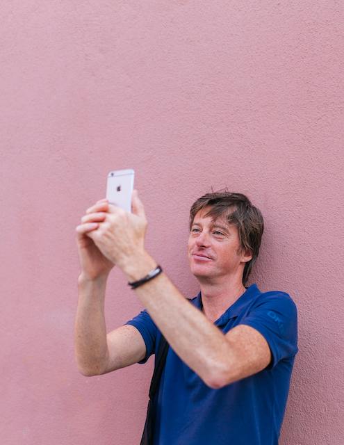 Person taking a selfie with the app
