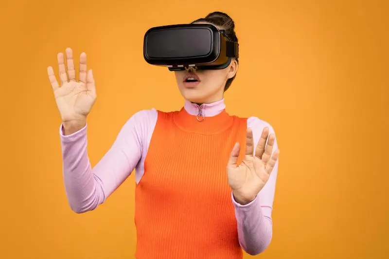 Person wearing VR headset experiencing immersive virtual reality environment, representing Meta's AI and Metaverse ambitions